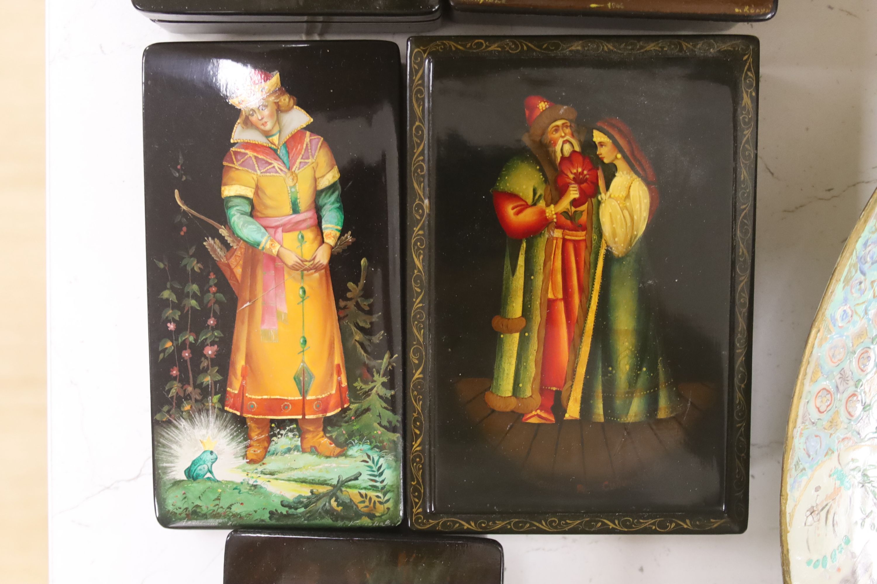 Six Russian painted lacquer boxes, each signed and inscribed, largest 18 x 13cm